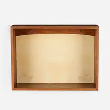 Wall-hanging shelf by Phillip Lloyd Powell, c. 1970, walnut, felt, sold Oct 2021
