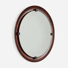 Mirror by Franco Campo and Carlo Graffi, c. 1960, bent rosewood plywood, mirrored glass, lacquered wood, sold Oct 2021