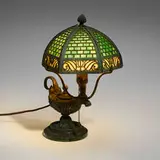 Aladdin boudoir lamp by Bradley & Hubbard Manufacturing Company, c. 1905, patinated metal, slag glass, iron, sold Feb 2024