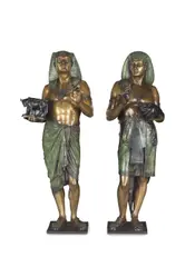 pair of large green verdigris and patinated bronze figures of an Egyptian Priest 'Pastophore' and an Egyptian scribe 'Hierogrammate' by Émile Louis Picault, patinated bronze, sold Feb 2024