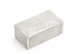 Russian silver trompe L'oeil cigar box, maker's mark in Cyrillic 'MI', Moscow, 1880, of rectangular form with gilt interior