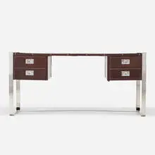 Desk by attribution Jacques Adnet, c. 1975, chrome-plated brass, leather, sold Oct 2021