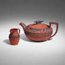 Wedgwood, Rosso Antico teapot and creamer, c. 1810, red stoneware with applied relief in black basalt