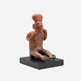 Pre-Columbian, Nayarit seated figure, terracotta, painted mahogany