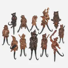 Black Forest, Collection of twelve carved whip holders, c. 1885, carved and varnished wood, horn, glass, brass