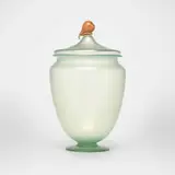 Lidded jar with pear finial by Alexander Joseph von Steuben, c. 1928, hand-blown Aqua Marine glass with applied Rose glass, sold Oct 2023