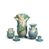 Three Vases and a Pair of Candlesticks by Roseville Pottery Company, glazed earthenware, each with molded mark 'Roseville U, offered May 2023