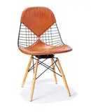 Charles and Ray Eames, Wire mesh chair with dowel legs, 1951-53, Enameled steel, postman's bag brown leather, birch