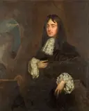 Sir Peter Lely, Portrait of a gentleman, three-quarter-length, in black costume with a white lace jabot, standing beside a stone bust statue of a woman, oil on canvas