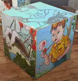 David Bromley, A painted cube depicting various scenes of childhood, acrylic on canvas laid on board