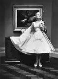 Bruno Benini, Gretta Miers wearing cocktail dress and cape from La Petite of Collins Street, National Gallery of Victoria