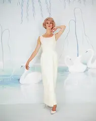 Bruno Benini, Janice Wakely wears a silk evening gown against a studio backdrop painted by Hazel Benini, 1965, c-type photograph