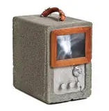Nancy Reddin & Edward Kienholz, The Block Head, 1981, Sculpture with pumice construction block, Fresnal lens system, wood, leather, and transistor radio