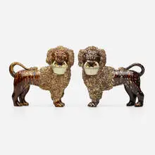Bennington Potters, Poodles with baskets, pair, c. 1850, glazed earthenware
