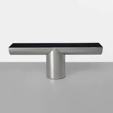 J. Wade Beam, Tee console, c. 1985, stainless steel, Vitrolite
