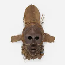 Gunyege mask by Dan, carved wood, fabric, feathers, sold Jul 2021