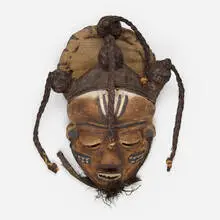 Chokwe, Mask, carved and painted wood, palm fibers