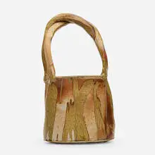 Large basket by Ken Ferguson, c. 1980, glazed stoneware, sold Jul 2021
