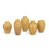 group of matte glazed porcelain vases in yellow, five by Rookwood Pottery, sold Apr 2022