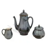 porcelain three-piece tea set in Nubian Black glaze: teapot, shape number 6518, sugar and creamer, shape number 6523 by Rookwood Pottery, sold Apr 2022