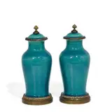 porcelain lidded vases in a most unusual blue over green mottled glaze with added metal mounts, pair by Rookwood Pottery, sold Apr 2022