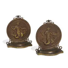 attribution Oscar Bach, bookends depicting Poseidon / Neptune in relief, pair