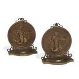 attribution Oscar Bach, bookends depicting Poseidon / Neptune in relief, pair