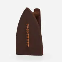 Cadeau by Man Ray, cast iron, steel tacks, sold Jun 2021