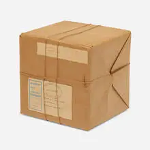 Wrapped Box by Christo, 1966, cardboard box, brown paper, and twine, sold Jun 2021