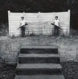 Michael Bishop, Untitled (Two Boys with Rifles), 1969, Gelatin silver print; signed 'Michael Bishop 1969' in ink on the verso; matted