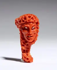 Coral carving depicting a female figure by Carlo Parlati, entirely carved from a single branch of Cerasuolo coral (Corallium elatius) of exceptional chromatic quality., offered Sep 2026