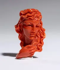 Coral carving depicting a female figure by Carlo Parlati, Entirely carved from a single branch of Cerasuolo coral (Corallium elatius) of exceptional chromatic quality., offered Sep 2026