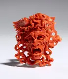 Carlo Parlati, Coral carving depicting the head of Medusa, entirely carved from a single branch of Cerasuolo coral (Corallium elatius) of exceptional chromatic quality.