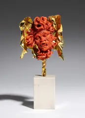Important coral and gold sculpture depicting the head of Medusa by Carlo Parlati, one of the most iconic mythological subjects in Carlo Parlati's artistic production. The face, offered Sep 2026