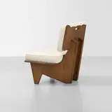 Frank Lloyd Wright, lounge chair from the Dorothy Turkel House, Detroit, 1955, carved walnut, upholstery