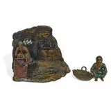 Franz Xaver Bergmann, figural sculpture of a seated Arab woman next to a basket