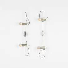 sconces model 255, pair by Tito Agnoli, c. 1955, nickel-plated brass and steel, steel, enameled brass, plastic, brass, rubber, sold Apr 2012