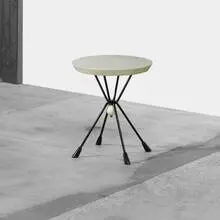 occasional table from the Schenecker House, Fort Worth by William 'Billy' Haines, 1952, enameled steel, leather, lacquered wood, sold Apr 2012