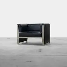 William Sofield, lounge chair, 2000, stainless steel, vinyl