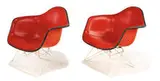 Pair of armchairs (2) by Charles and Ray Eames, 1950, Molded fiberglass with wire rod base and red naugahyde pad, sold Dec 2011