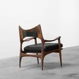 Phillip Lloyd Powell, lounge chair, c. 1960, carved walnut, leather
