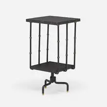 Rotating book table by Jacques Adnet, c. 1955, enameled iron, brass, leatherette, sold Mar 2021
