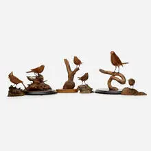 K. E. Carl, Collection of six bird sculptures, 1985-89, hand-carved wood, driftwood, enameled metal