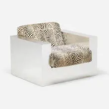 Lounge chair by Milo Baughman, c. 1960, stainless steel over wood, upholstery, sold Mar 2021