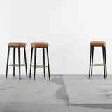 Jansen, stools, set of three, c. 1960, lacquered wood, leather, brass