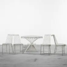 Cap d'Ail table and set of four chairs by Mathieu Matégot, 1952, enameled steel, glass, sold Apr 2011