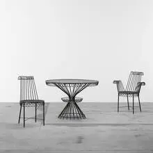 Cap d'Ail table and two chairs by Mathieu Matégot, 1952, enameled steel, glass, sold Apr 2011