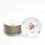 polychrome enamel decorated with flower sprigs and bouquets, molded basketweave borders and with gilded rim, underglaze blue crossed swords marks, dia.    9 7/8 in. by Twelve Meissen Porcelain Dinner Plates, sold Dec 2022