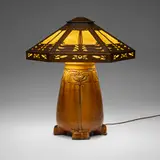Ernest Batchelder and Douglas Donaldson, Important and Rare table lamp with foliate motifs, c. 1908-10, glazed earthenware, patinated copper, slag glass