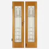 Doors from Northome, the second Francis W. Little House, Wayzata, Minnesota, pair by Frank Lloyd Wright, 1912-14, opaque and clear glass, copper-plated zinc came, oak, brass, offered Oct 2025